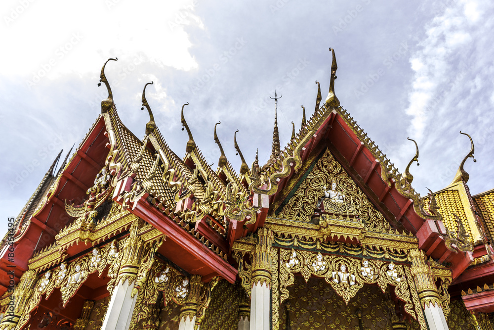 Thai Buddhist arched entrance against with blue sky Thai Buddhist arched entrance against with blue sky