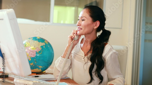 Casual businesswoman having phone call photo