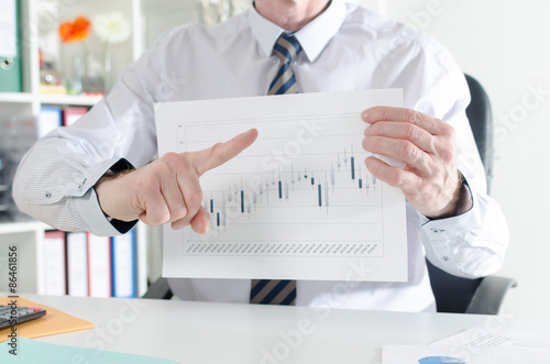Businessman showing the progress of the stock market