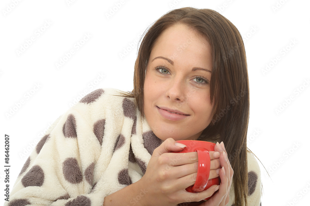 Attractive Young Woman Holding and Enjoying A Cup Of Tea Attractive Young Woman Holding and Enjoying A Cup Of Tea
