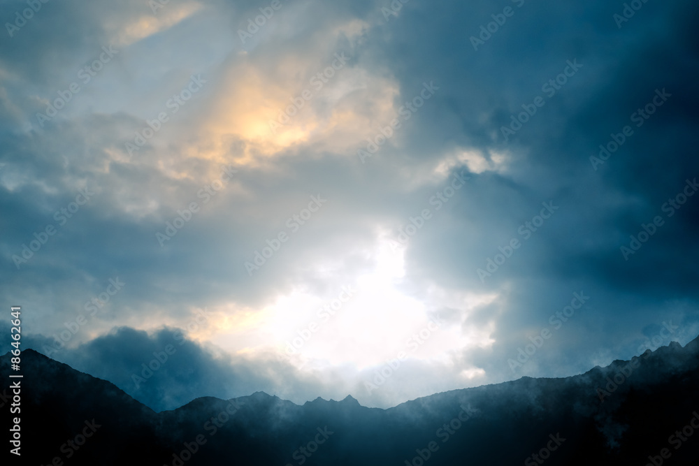 Nature - Mountain scenery with a dramatic sky against the light - computer generated image Nature - Mountain scenery with a dramatic sky against the light - computer generated image
