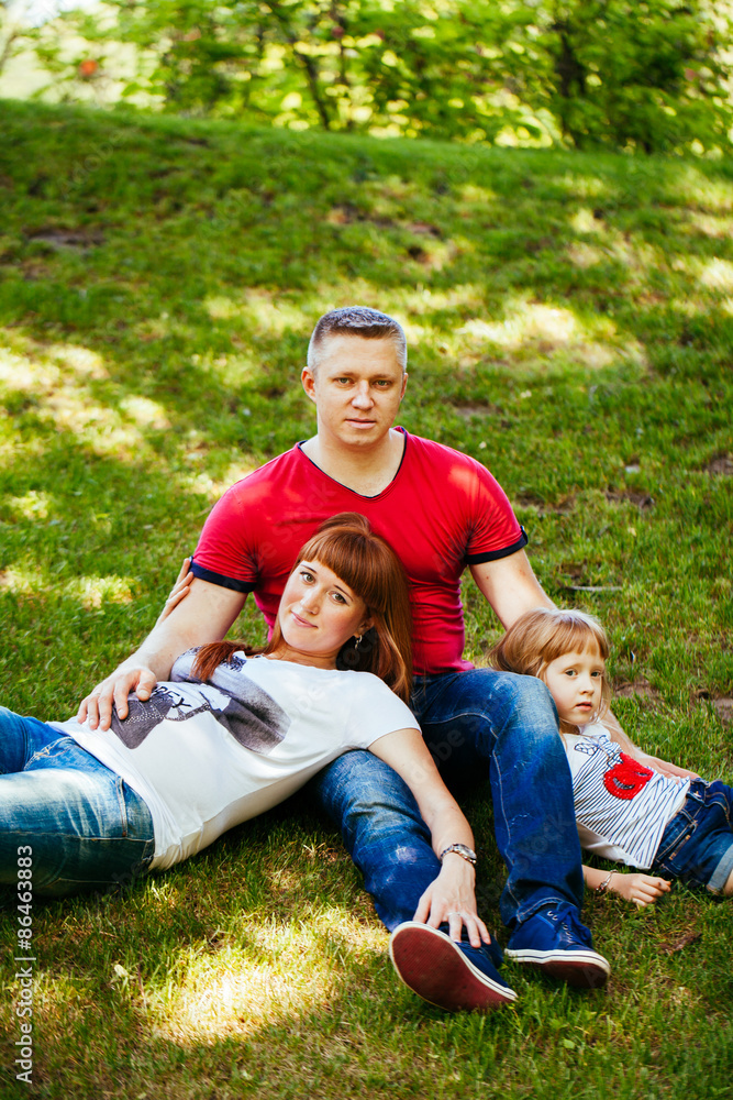A young family, a pregnant mother, father, daughter A young family, a pregnant mother, father, daughter