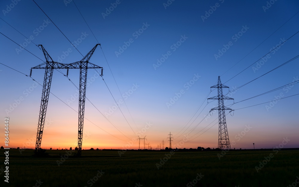 Large transmission towers at blue hour 