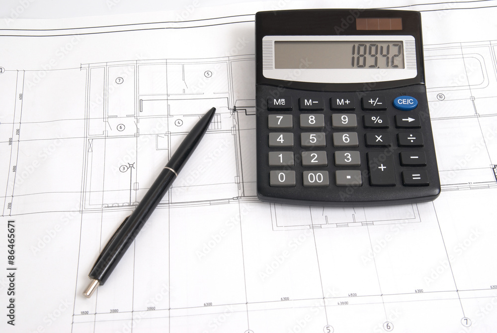 Calculator and pen on the drawing Calculator and pen on the drawing