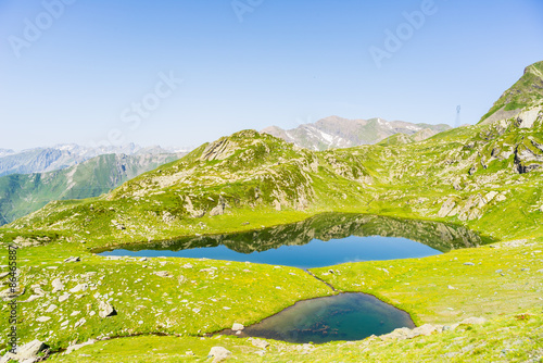 High altitude blue alpine lake in summertime