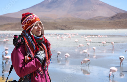 Happy woman travels in wild nature of Andes, Bolivia photo