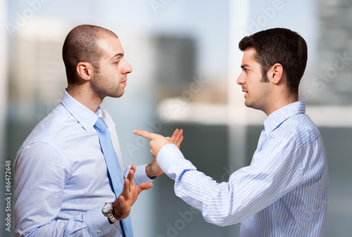 Businessman scolding a colleague photo