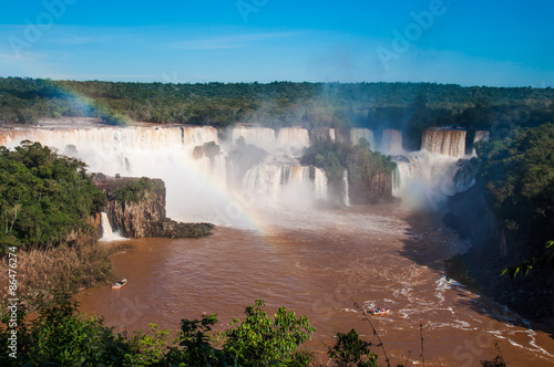 Rainbow over gorgeous waterfalls of Iguazu  Brazil