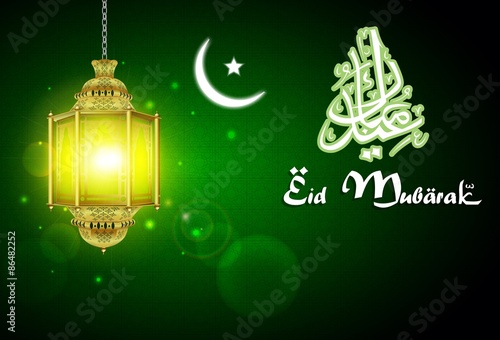 Eid Mubarak and quran with illuminated lamp