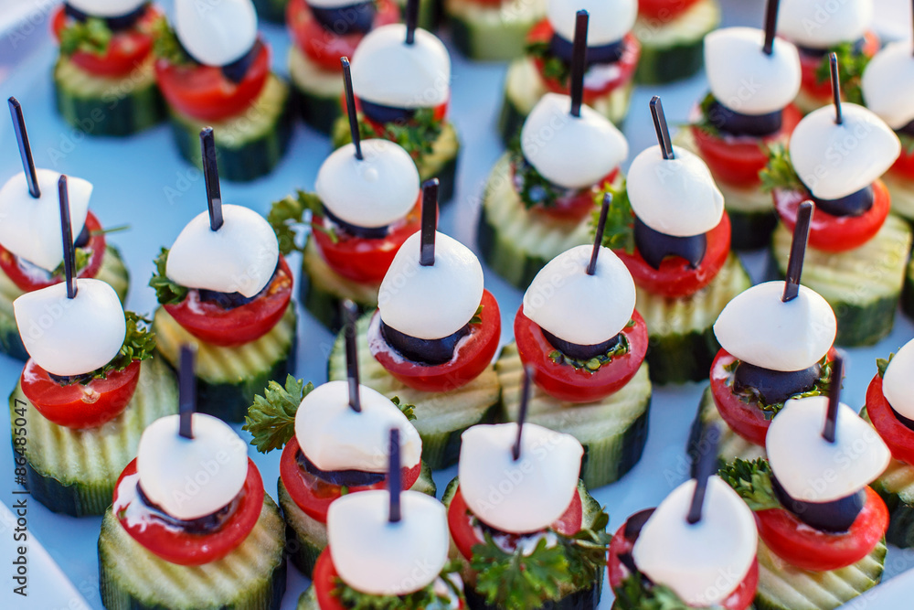 Snacks on white plates.