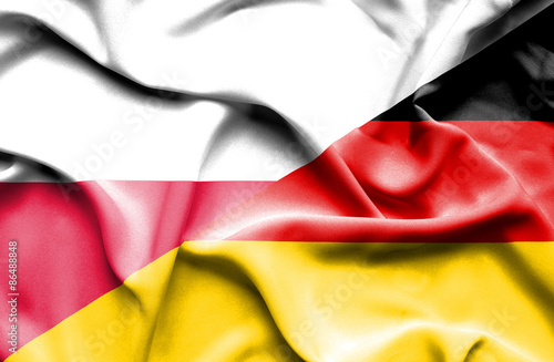 Waving flag of Germany and Poland