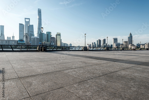 panoramic skyline of shanghai with empty street floor photo