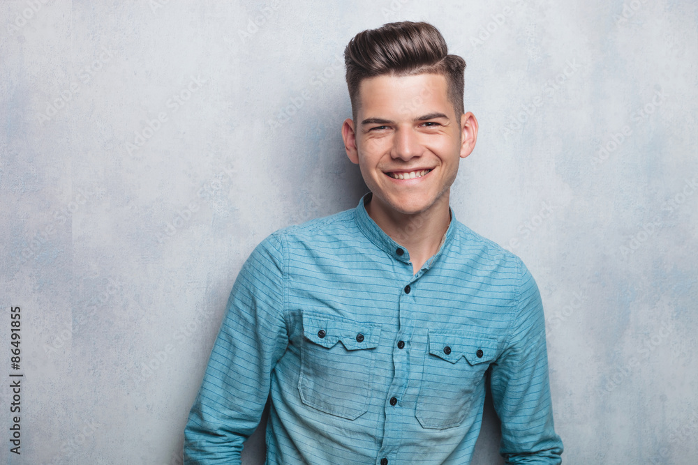 Smiling young man looking at the camera Smiling young man looking at the camera