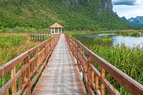 Fototapeta Naklejka Na Ścianę i Meble -  Beautiful of wooden bridge and lake in Sam Roi Yot National Park