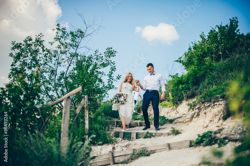 Wedding couple in a forest in the mountains