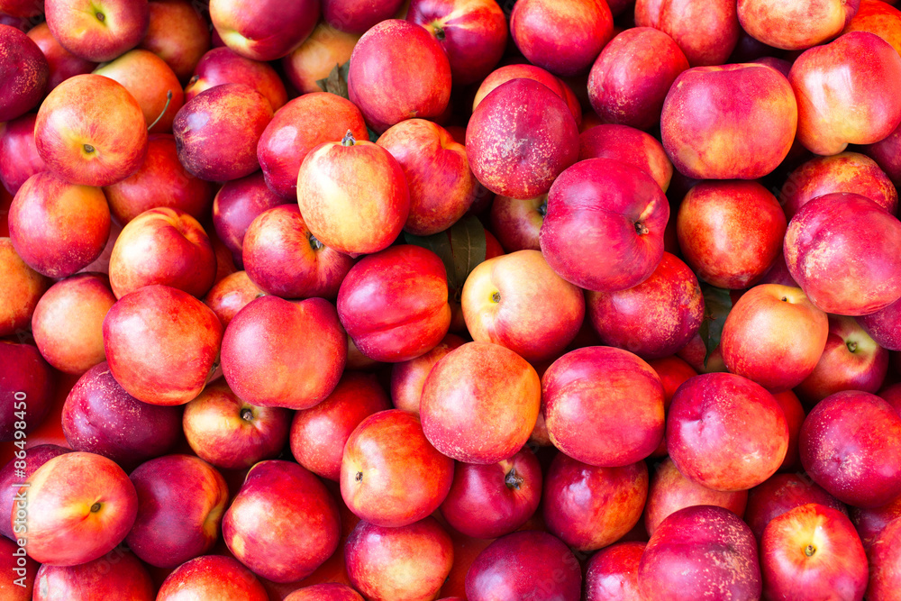 Heap Of Fresh Ripe Nectarines as a background Heap Of Fresh Ripe Nectarines as a background