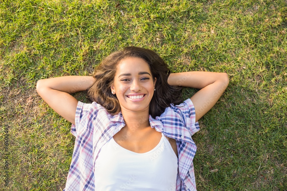 Pretty brunette relaxing in the grass Pretty brunette relaxing in the grass