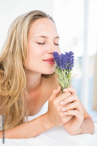 Beautiful blonde lying on massage table 