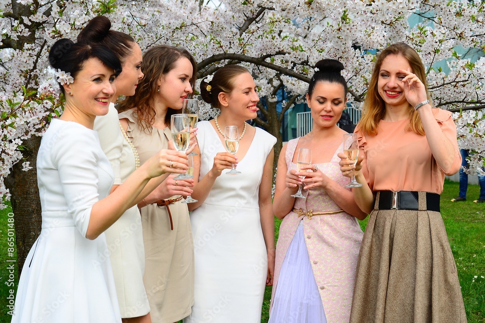 Girls with champagne celebrating in sakura's garden. Girls with champagne celebrating in sakura's garden.