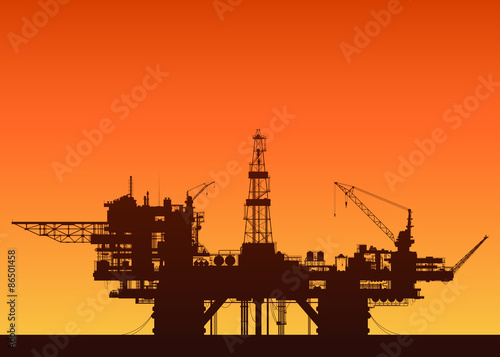 Sea oil rig at sunset. Oil platform in the sea.
