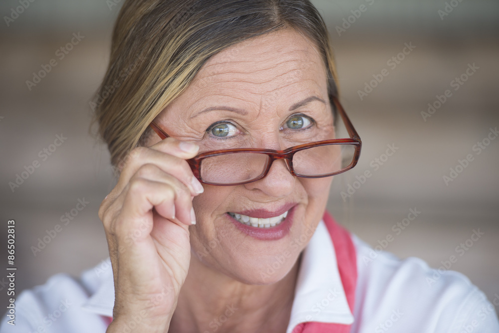 Mature woman with glasses happy smiling