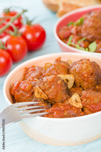Albondigas Guisadas - Meatballs in tomato sauce with garlic slivers and thyme leaves.
