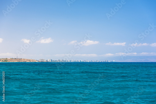Distant city seen from sea