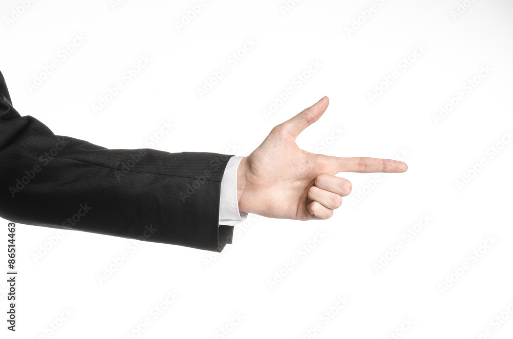 Businessman and gesture topic: a man in a black suit and white shirt showing hand gesture on an isolated white background in studio Businessman and gesture topic: a man in a black suit and white shirt showing hand gesture on an isolated white background in studio