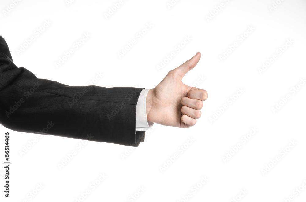 Businessman and gesture topic: a man in a black suit and white shirt showing hand gesture on an isolated white background in studio Businessman and gesture topic: a man in a black suit and white shirt showing hand gesture on an isolated white background in studio