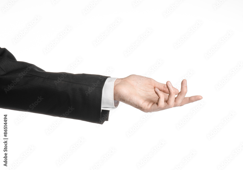 Businessman and gesture topic: a man in a black suit and white shirt showing hand gesture on an isolated white background in studio Businessman and gesture topic: a man in a black suit and white shirt showing hand gesture on an isolated white background in studio