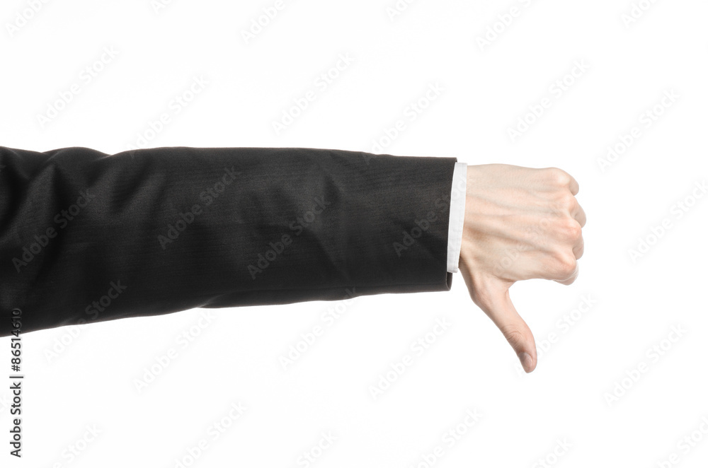 Businessman and gesture topic: a man in a black suit and white shirt showing hand gesture on an isolated white background in studio Businessman and gesture topic: a man in a black suit and white shirt showing hand gesture on an isolated white background in studio