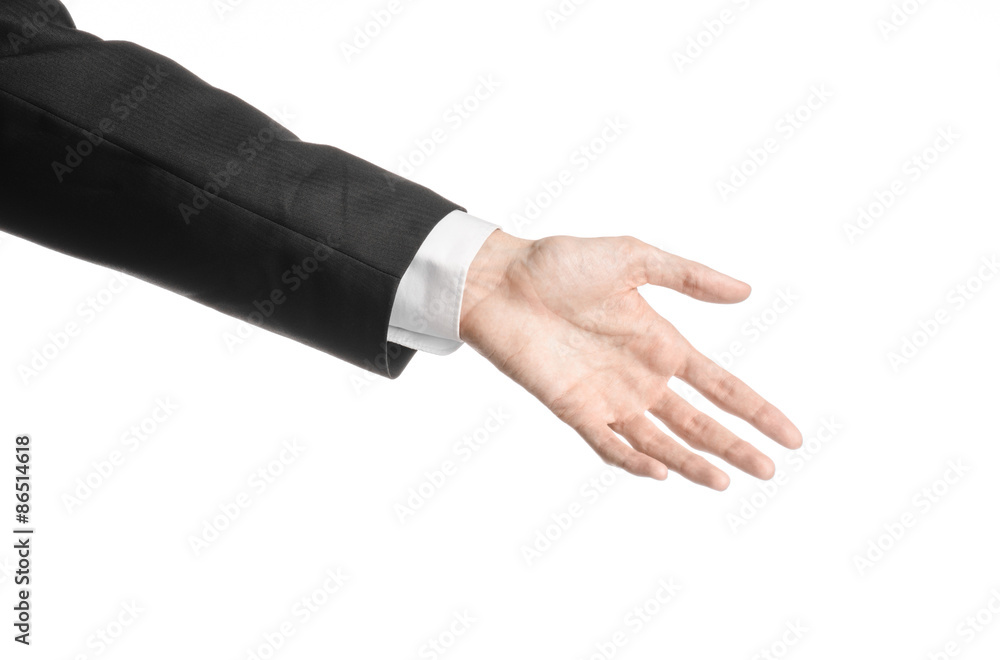 Businessman and gesture topic: a man in a black suit and white shirt showing hand gesture on an isolated white background in studio Businessman and gesture topic: a man in a black suit and white shirt showing hand gesture on an isolated white background in studio