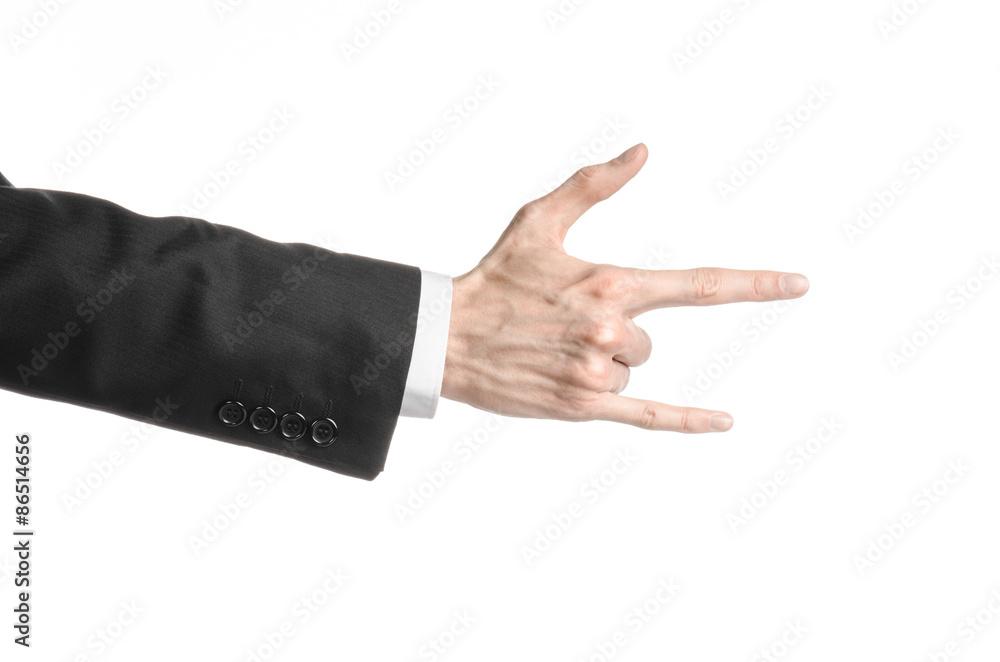 Businessman and gesture topic: a man in a black suit and white shirt showing hand gesture on an isolated white background in studio Businessman and gesture topic: a man in a black suit and white shirt showing hand gesture on an isolated white background in studio