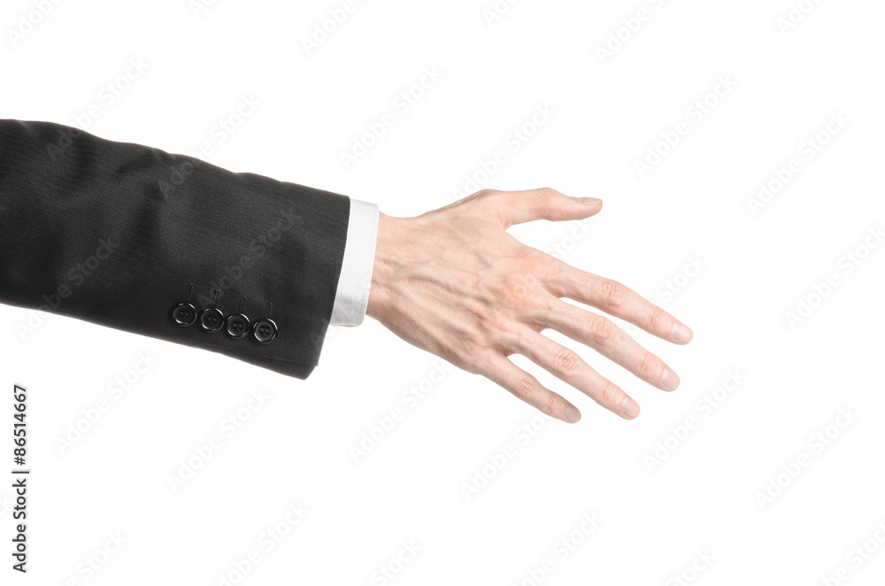 Businessman and gesture topic: a man in a black suit and white shirt showing hand gesture on an isolated white background in studio Businessman and gesture topic: a man in a black suit and white shirt showing hand gesture on an isolated white background in studio
