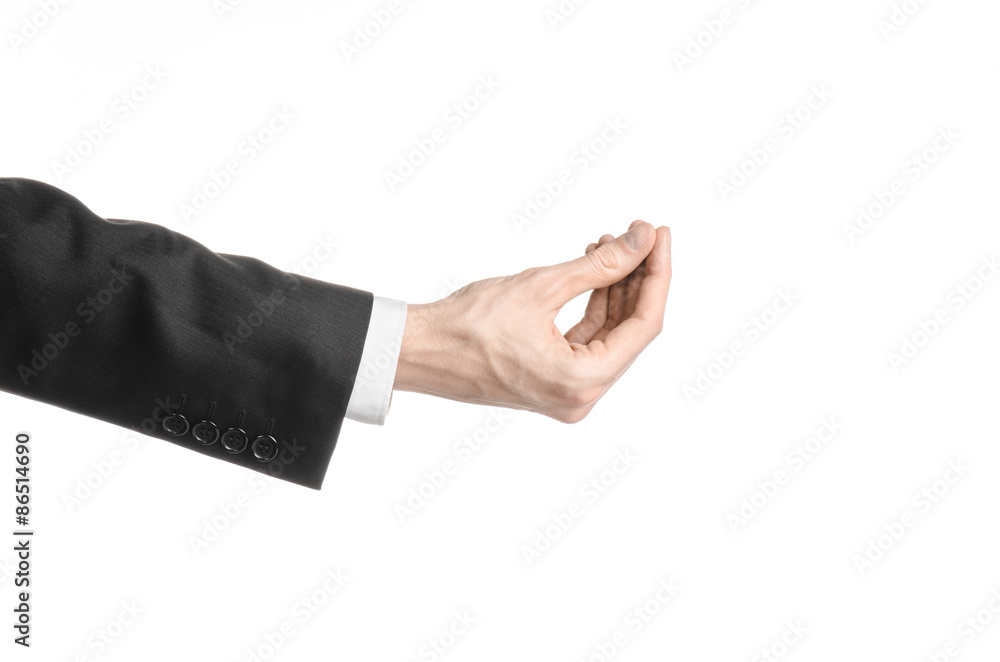 Businessman and gesture topic: a man in a black suit and white shirt showing hand gesture on an isolated white background in studio Businessman and gesture topic: a man in a black suit and white shirt showing hand gesture on an isolated white background in studio