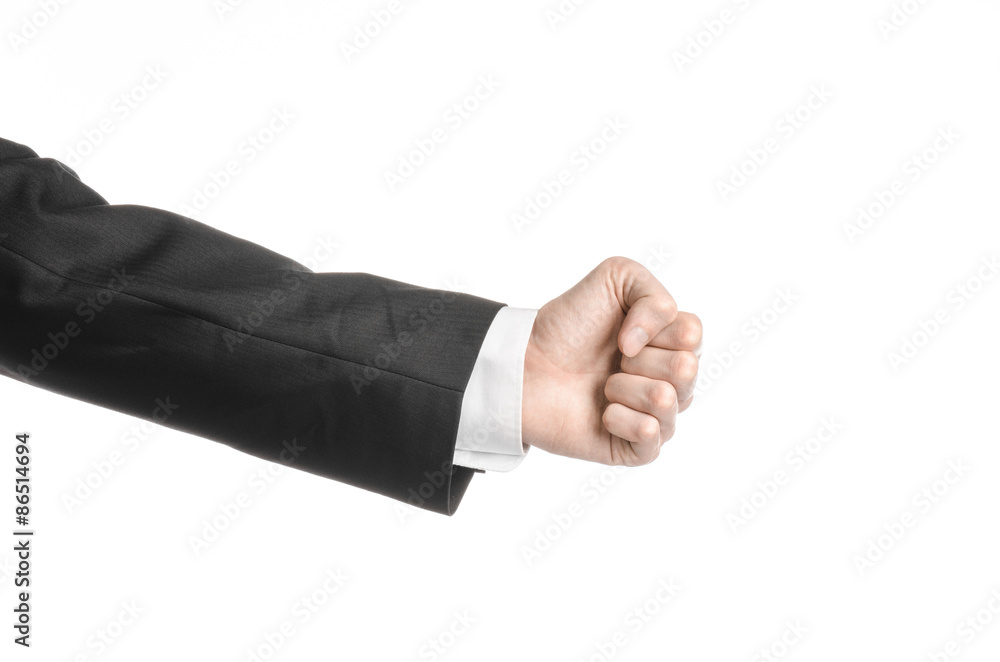 Businessman and gesture topic: a man in a black suit and white shirt showing hand gesture on an isolated white background in studio Businessman and gesture topic: a man in a black suit and white shirt showing hand gesture on an isolated white background in studio