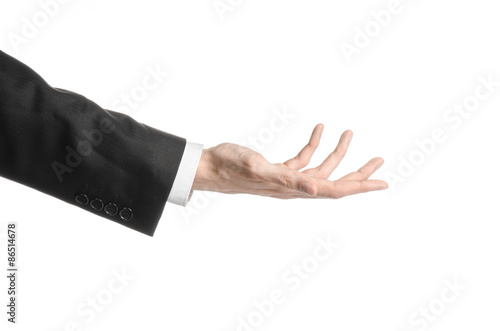 Businessman and gesture topic: a man in a black suit and white shirt showing hand gesture on an isolated white background in studio