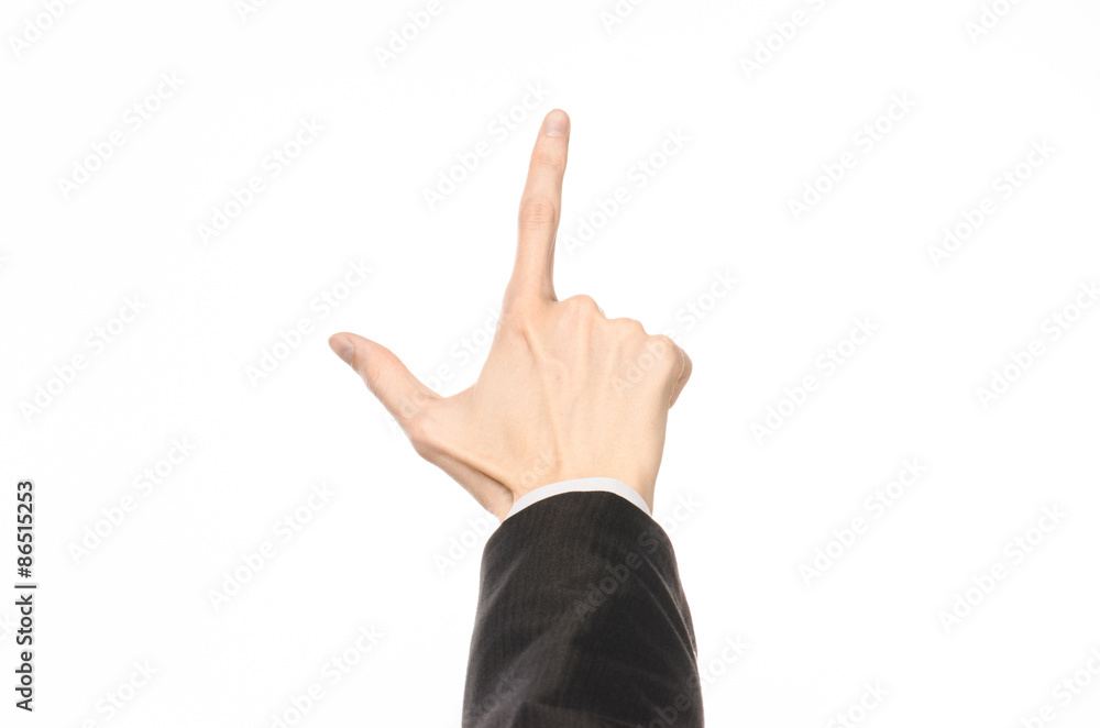 Gestures and Business theme: businessman shows hand gestures with a first-person in a black suit on a white background isolated