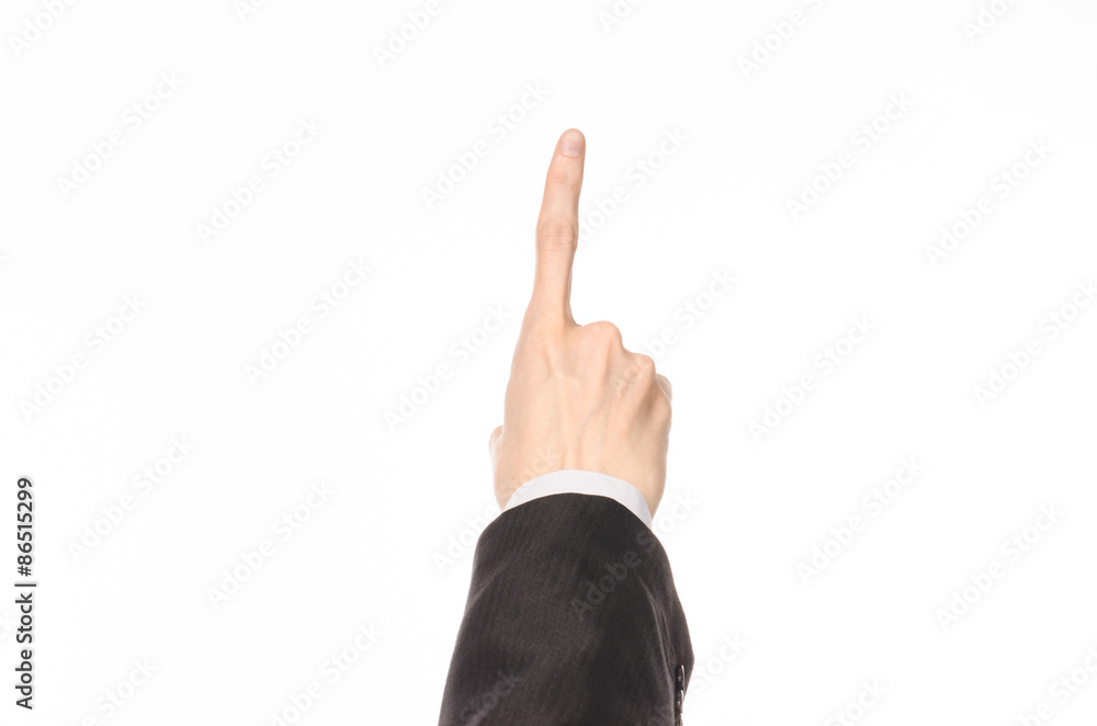 Gestures and Business theme: businessman shows hand gestures with a first-person in a black suit on a white background isolated