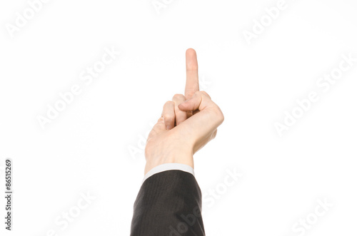 Gestures and Business theme: businessman shows hand gestures with a first-person in a black suit on a white background isolated