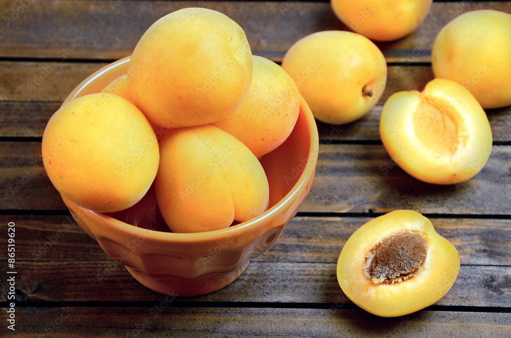 Orange bowl with apricots Orange bowl with apricots