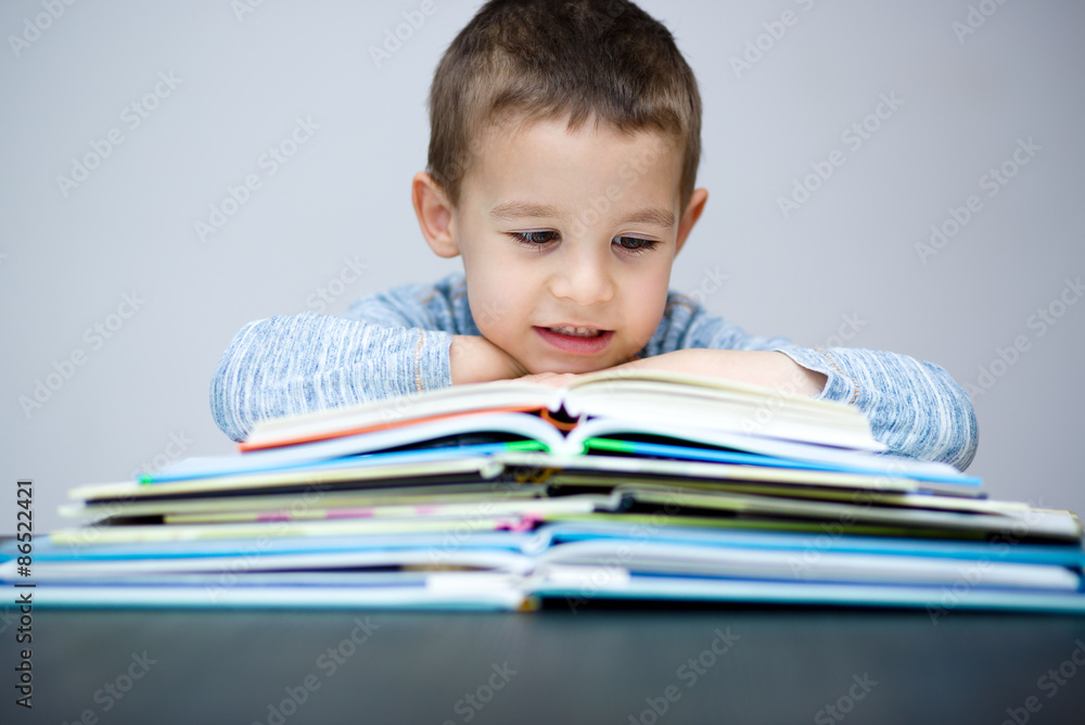Little boy is reading a book Little boy is reading a book