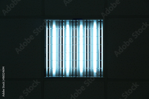 Fluorescent lights in office ceiling