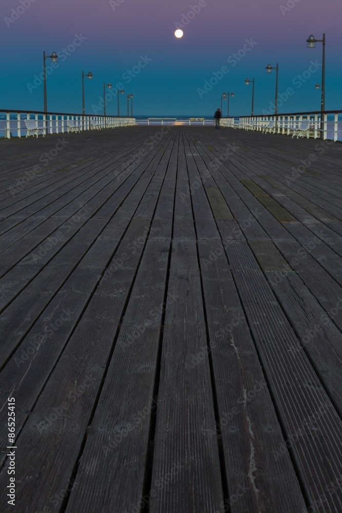 Beautiful wooden pier on Baltic sea shore