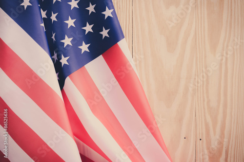 independence day 4 JULY america flag on wood background Filtered image processed vintage effect.