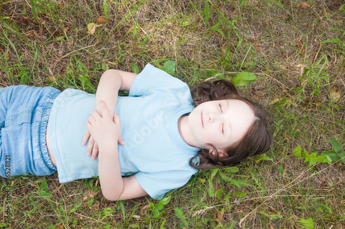 girl lying on the grass