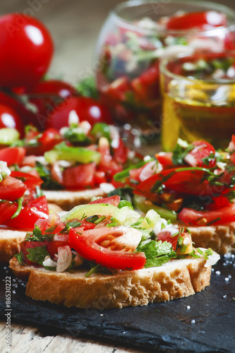 Italian bruschetta with tomato, onion and bell pepper, selective