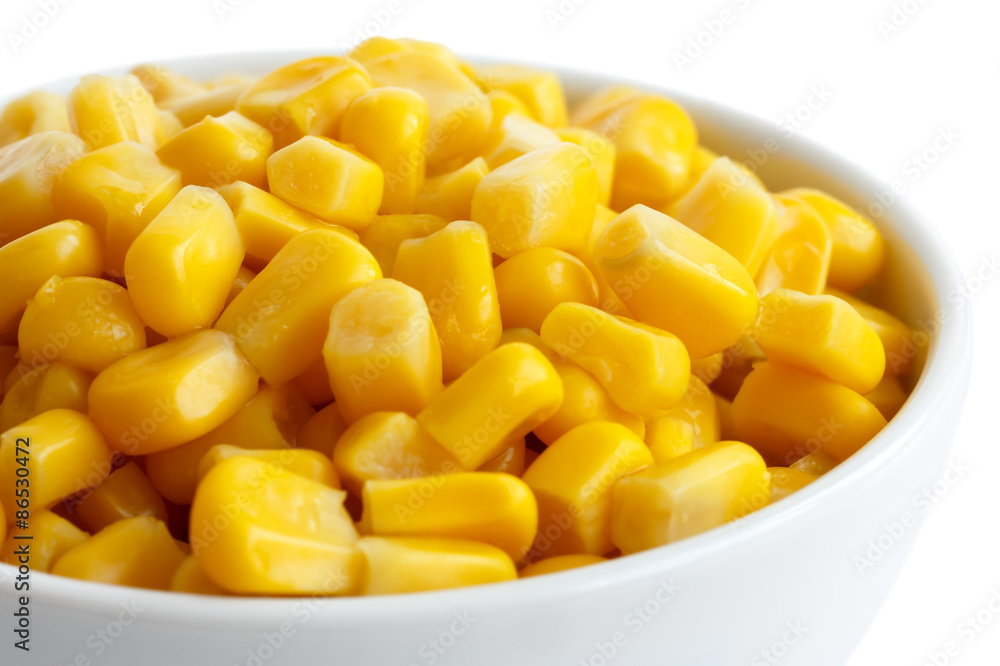 Bowl of tinned sweetcorn isolated on white. Detail. Bowl of tinned sweetcorn isolated on white. Detail.