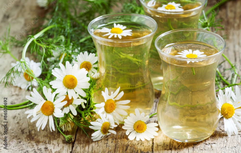 Fresh chamomile tea, selective focus Fresh chamomile tea, selective focus