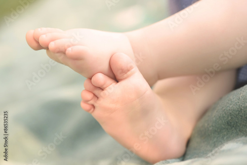 Closeup photo of baby legs © SasaStock